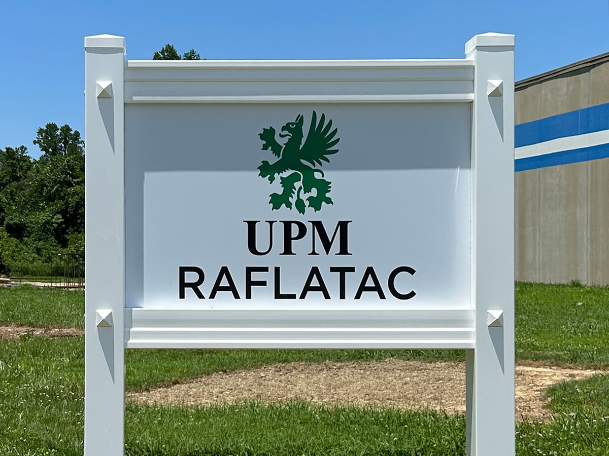 UPM Raflatac freestanding sign in a white architectural vinyl sign frame installed in Mills River, NC
