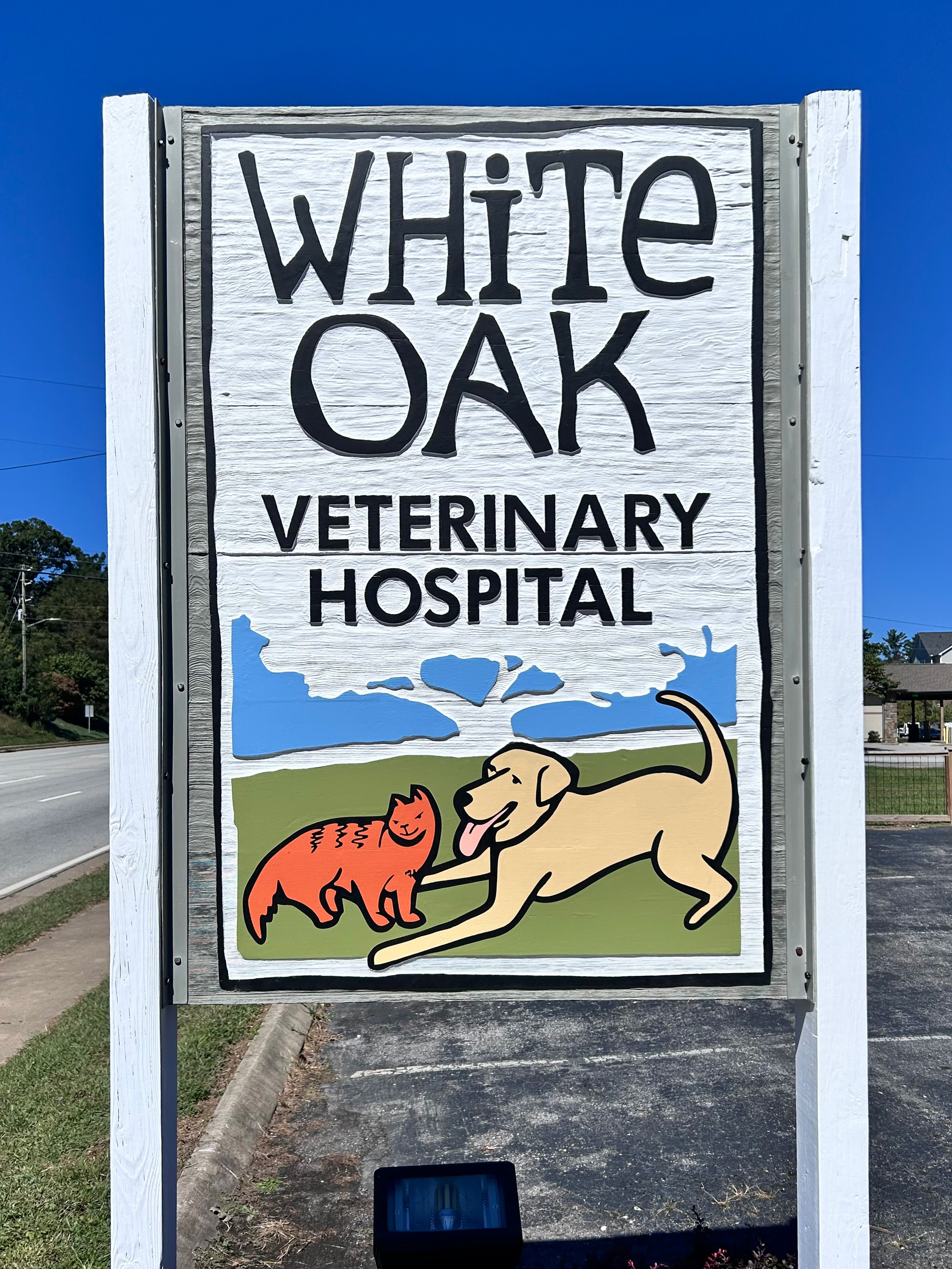 Restored sandblasted wood sign for White Oak Veterinary Hospital in Fletcher North Carolina