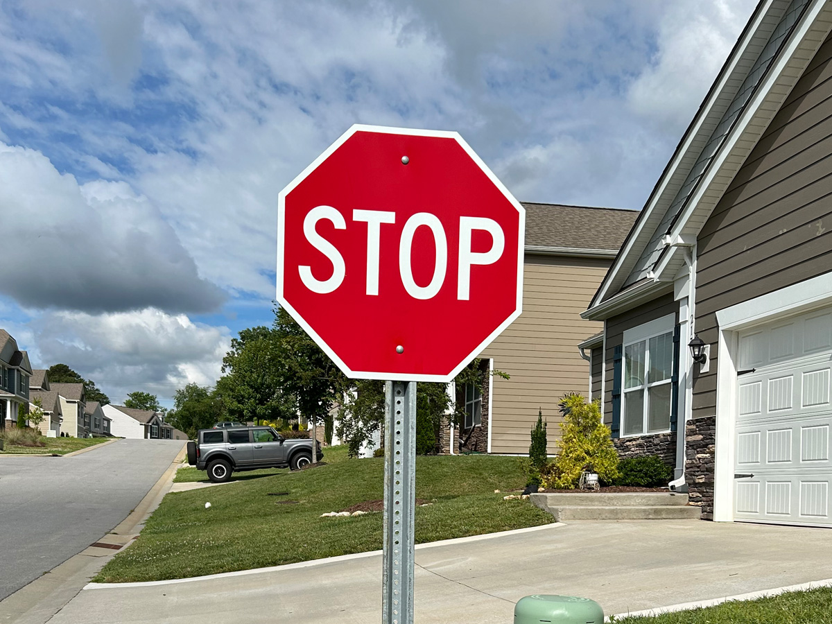 STOP traffic-control sign installed by Asheville Signworks in a residential community