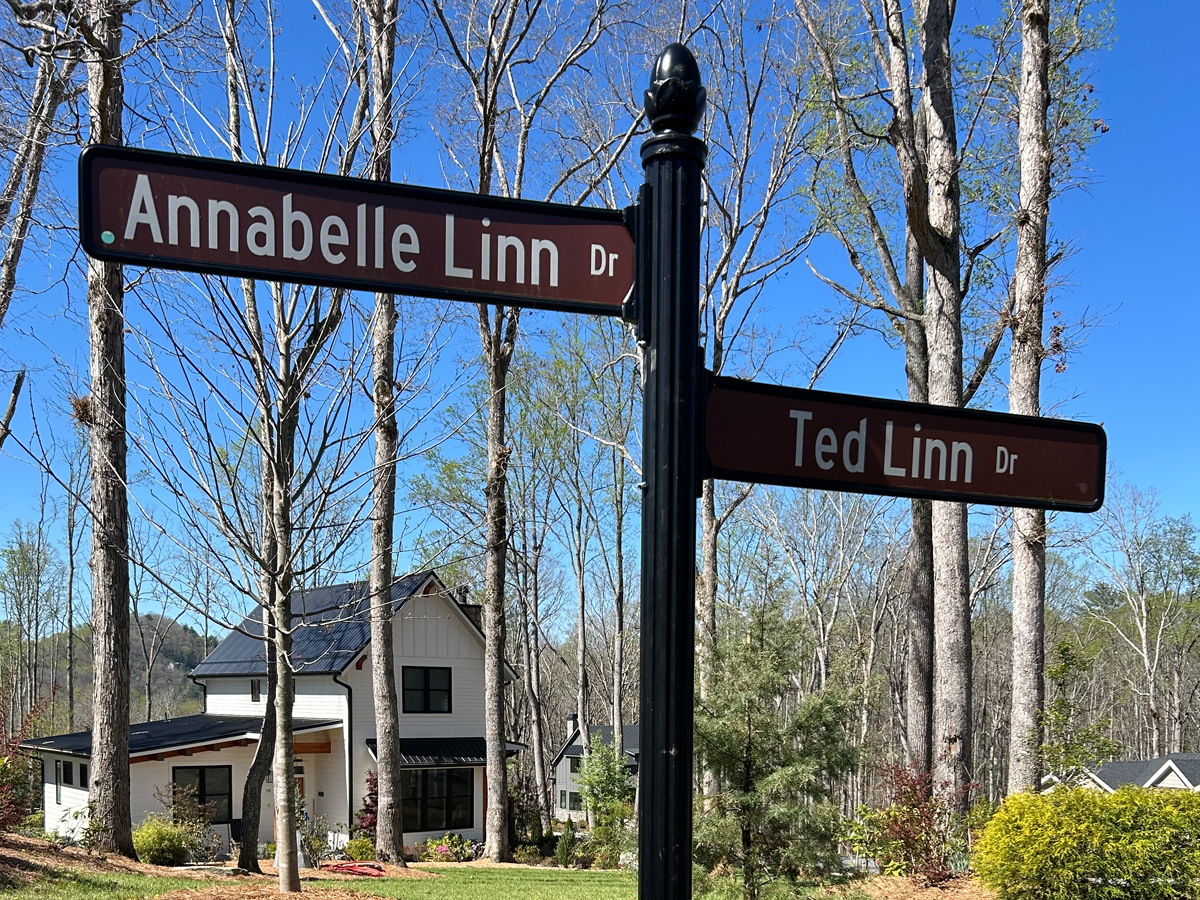 Custom Annabelle Linn Drive and Ted Linn Drive neighborhood street signs mounted to decorative black post in Fairview North Carolina