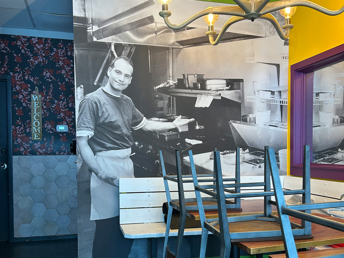 Historic photograph of Salsa restaurant founder Hector Diaz installed as a large interior wall mural in downtown Asheville North Carolina