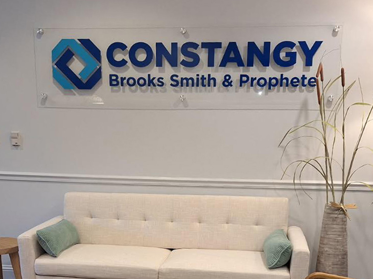 Constangy Brooks Smith and Prophete dimensional lobby sign mounted to a clear acrylic panel in Asheville North Carolina