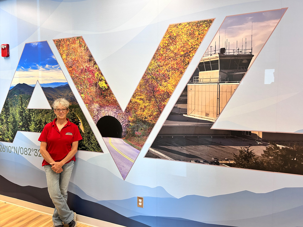 Floor-to-ceiling AVL wall graphic installed by Asheville Signworks in five large vinyl panels