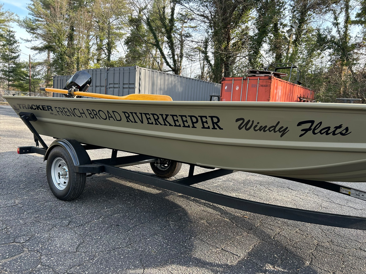 French Broad Riverkeeper Windy Flats boat with custom cast vinyl lettering