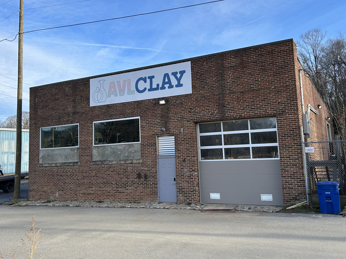 Custom storefront sign created by Asheville Signworks