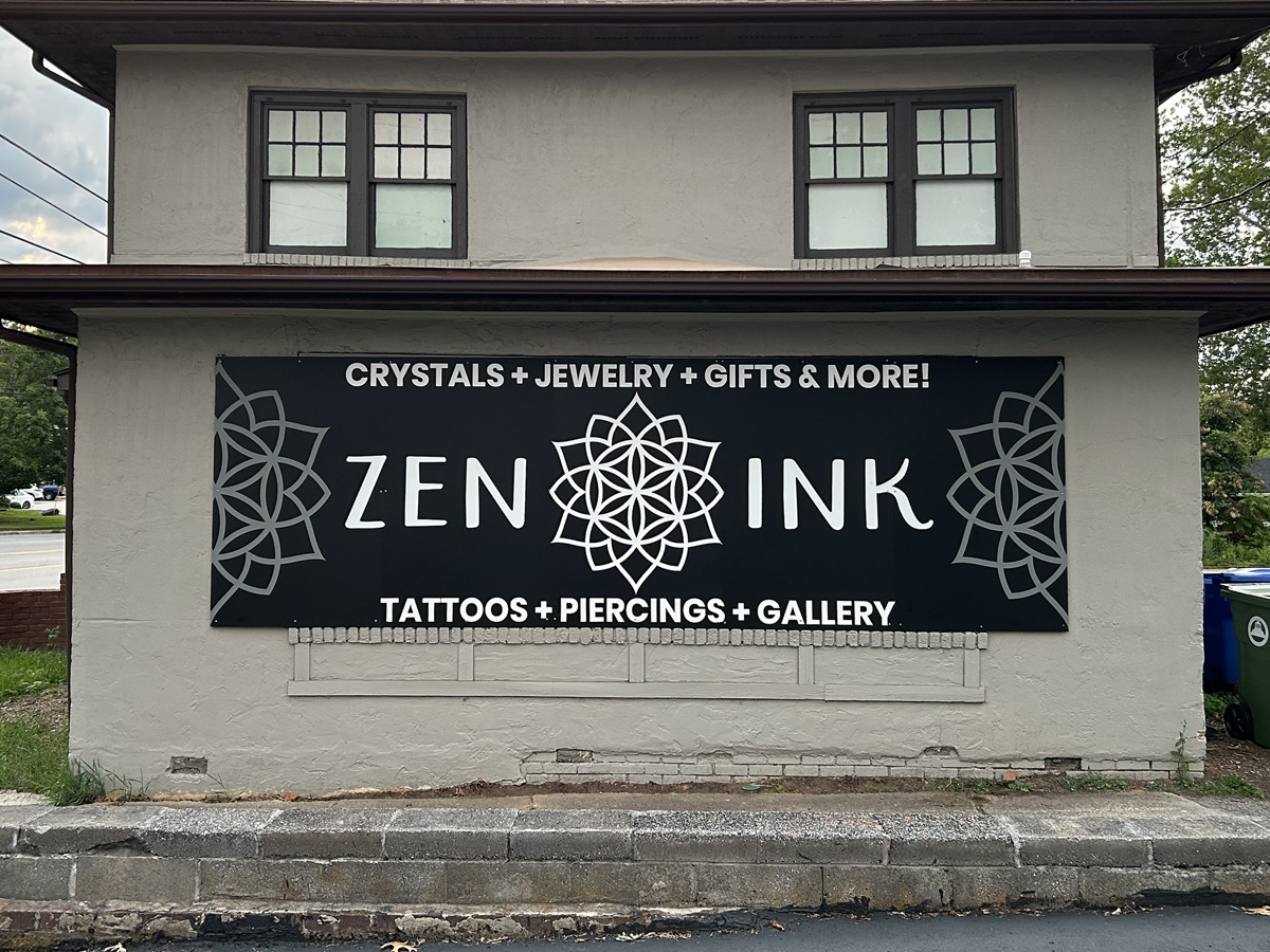 Dimensional storefront lettering installed on an Asheville business